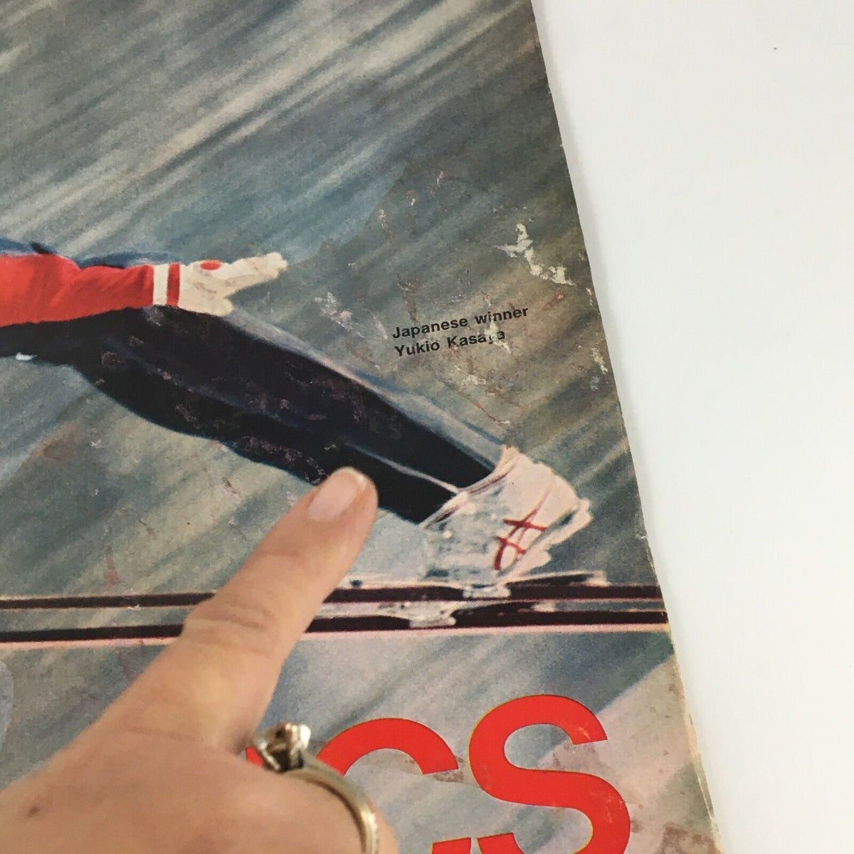 Detailed view of the cover of VTG Life Magazine February 18 1972, focusing on text indicating 'Japanese winner Yukio Kasaya', with visible signs of age that enhance the vintage character of the magazine.