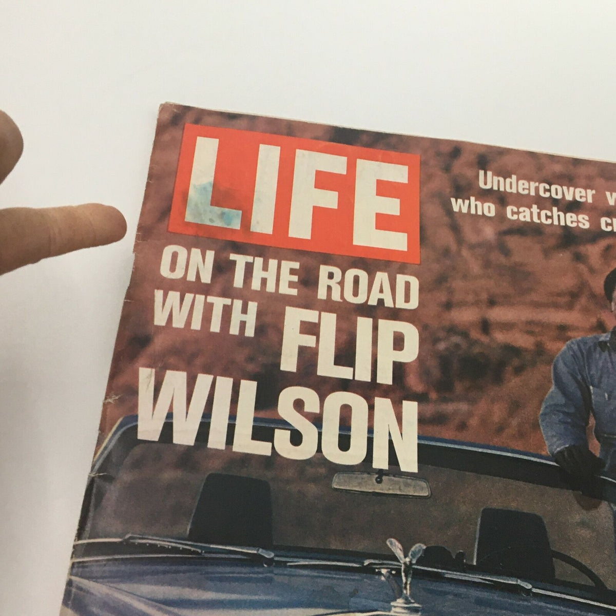 Close-up view of the cover of VTG Life Magazine August 4 1972 featuring comedian Flip Wilson, showcasing the title and a brief description of the article.