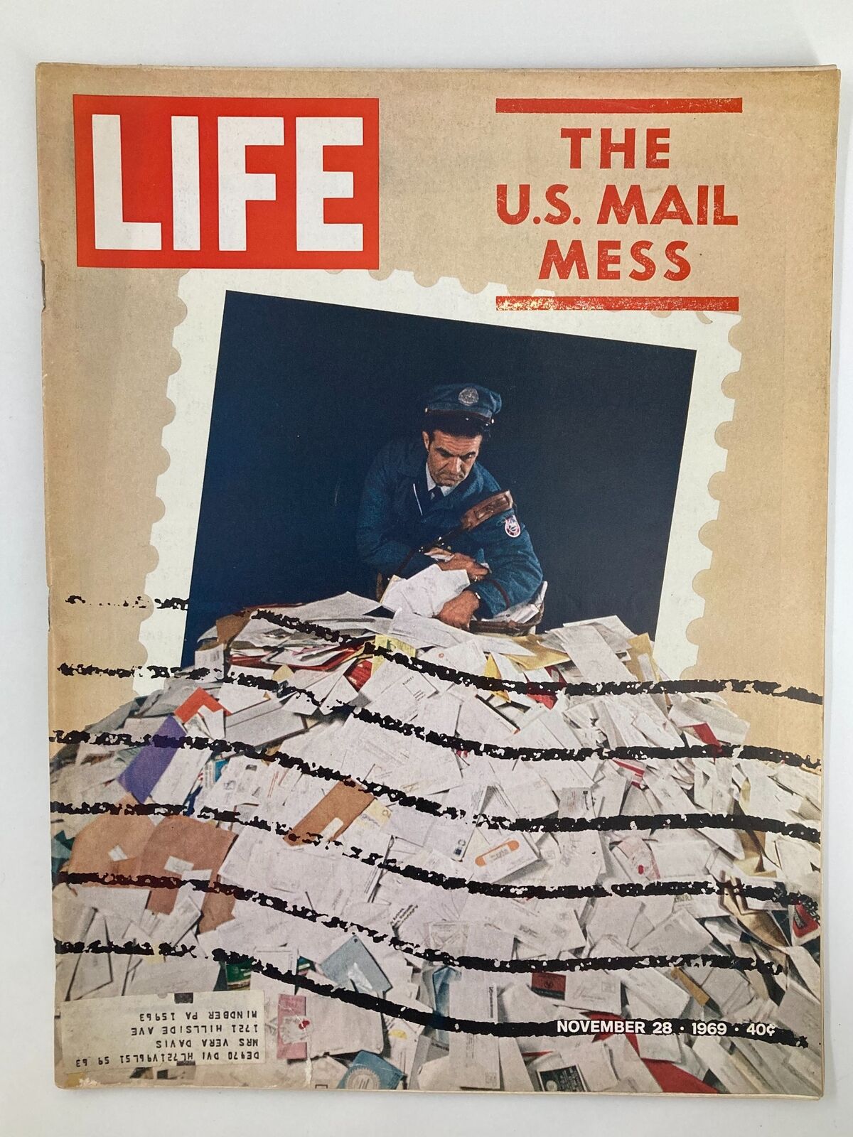 Cover of VTG Life Magazine from November 28, 1969, featuring a postal worker surrounded by a pile of letters, illustrating the U.S. Mail Mess.