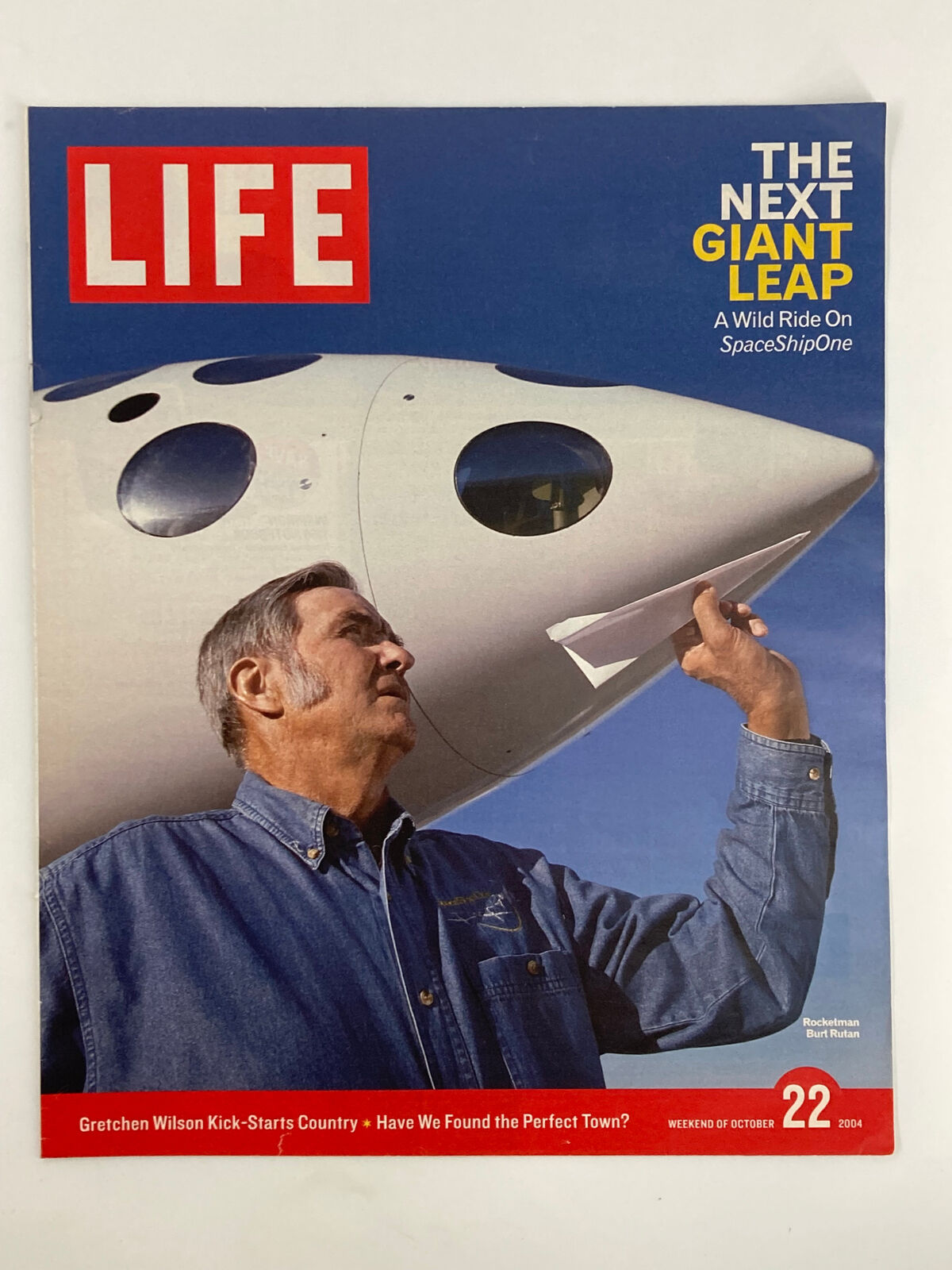 Life Magazine Newspaper Insert featuring Burt Rutan, dated October 22, 2004, showcasing the visionary aerospace engineer alongside the SpaceShipOne aircraft, emphasizing advancements in private spaceflight.