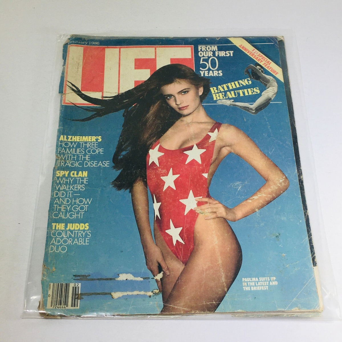VTG Life Magazine February 1986 cover featuring a model in a star-patterned red bathing suit with the headline 'Bathing Beauties' and articles on Alzheimer's and the 'Spy Clan'.