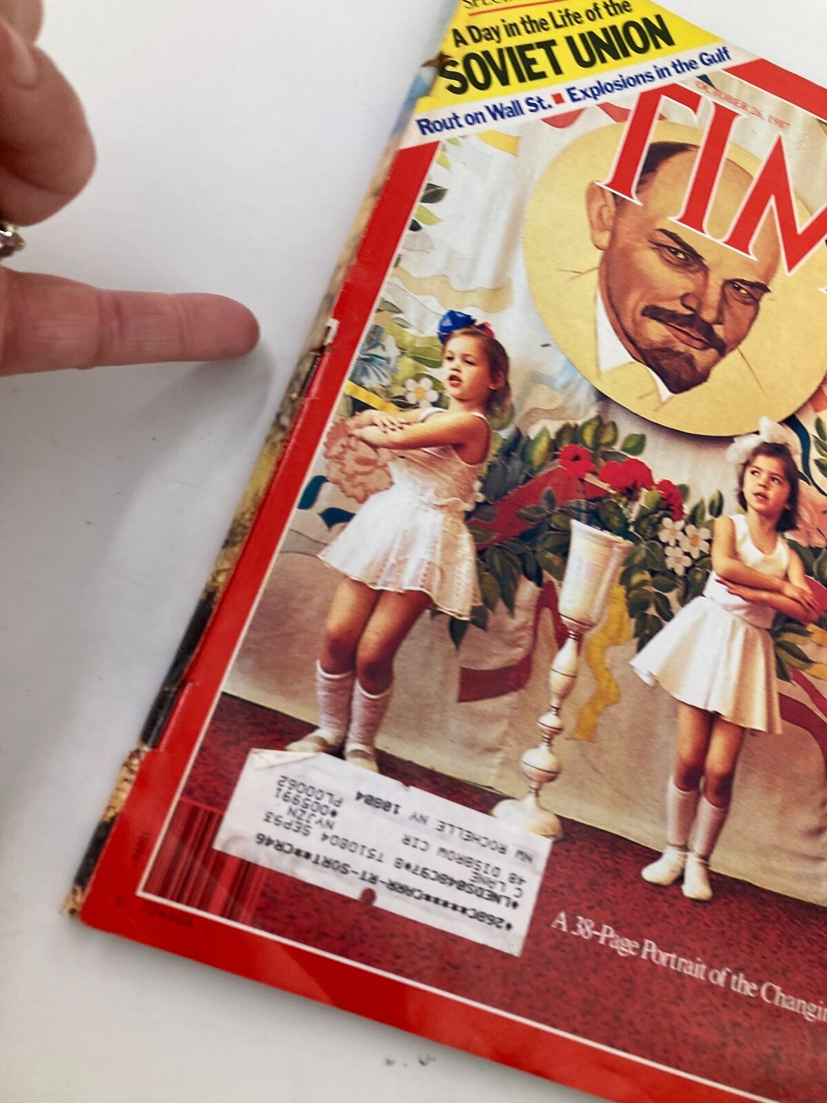 Close-up image of the Vintage Time Magazine cover from October 26, 1987, showing details of the portrait of Lenin and children in white dresses. The title reads 'A Day in the Life of the Soviet Union'.