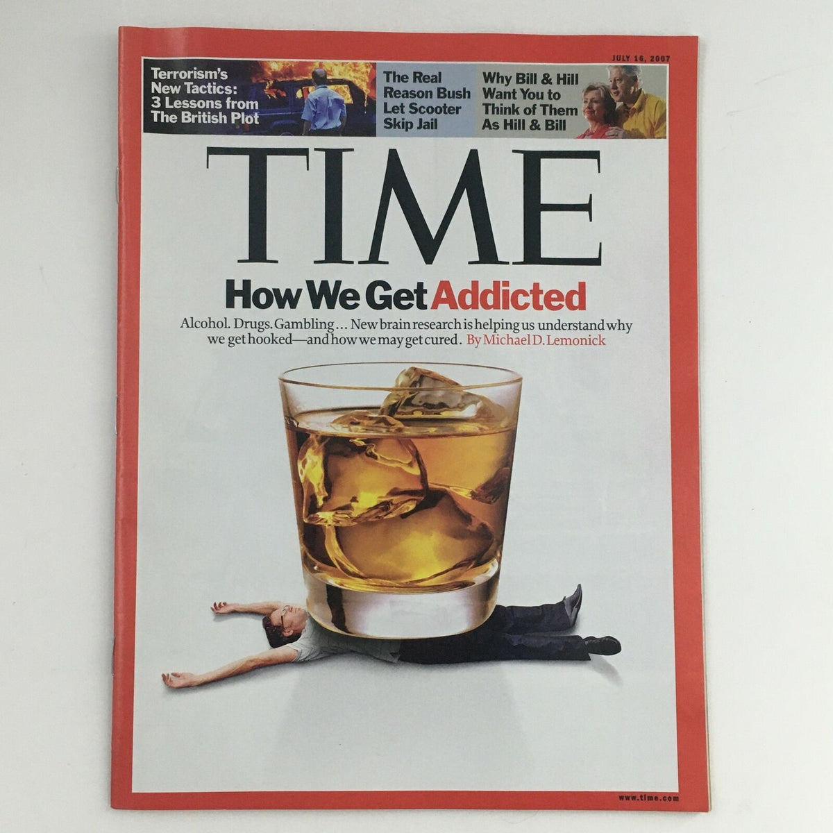 Time Magazine July 16, 2007 cover featuring a depiction of addiction, showcasing a glass of whiskey and an image symbolizing struggle. This iconic issue includes political figures like Hillary and Bill Clinton alongside George Bush, reflecting pivotal moments in American political history.
