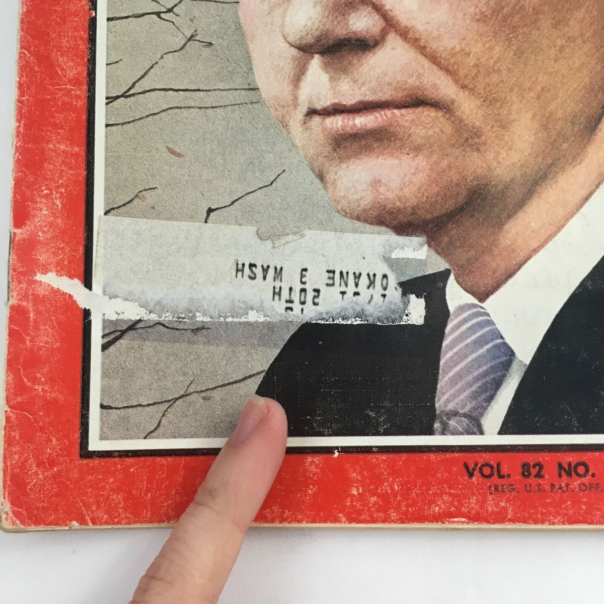 Cover detail of Time Magazine December 6 1963 featuring Secretary of State Dean Rusk, highlighting signs of wear and a finger pointing at the corner.