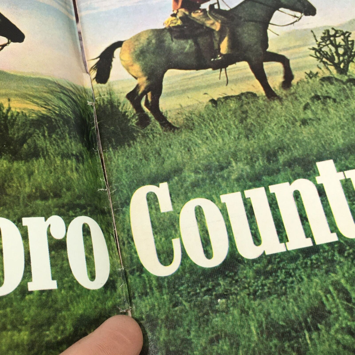 Inside view of VTG Time Magazine: July 4 1776, showing a page with a horse and rider, part of the historical narrative.