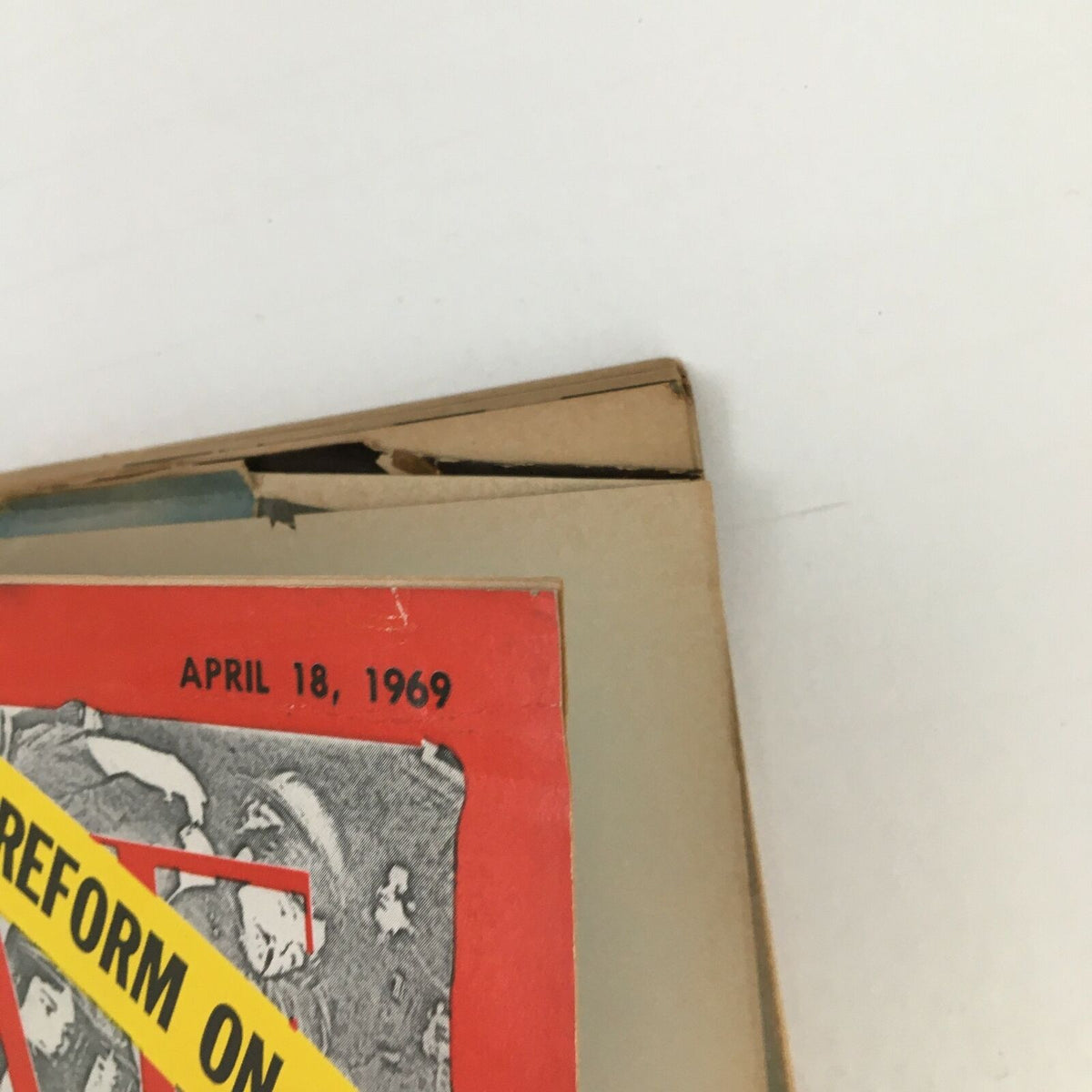 Close-up view of the top edge of Time Magazine April 18 1969, showcasing the publication date and the bold headline 'RAGE AND REFORM ON CAMPUS' against a vintage design.