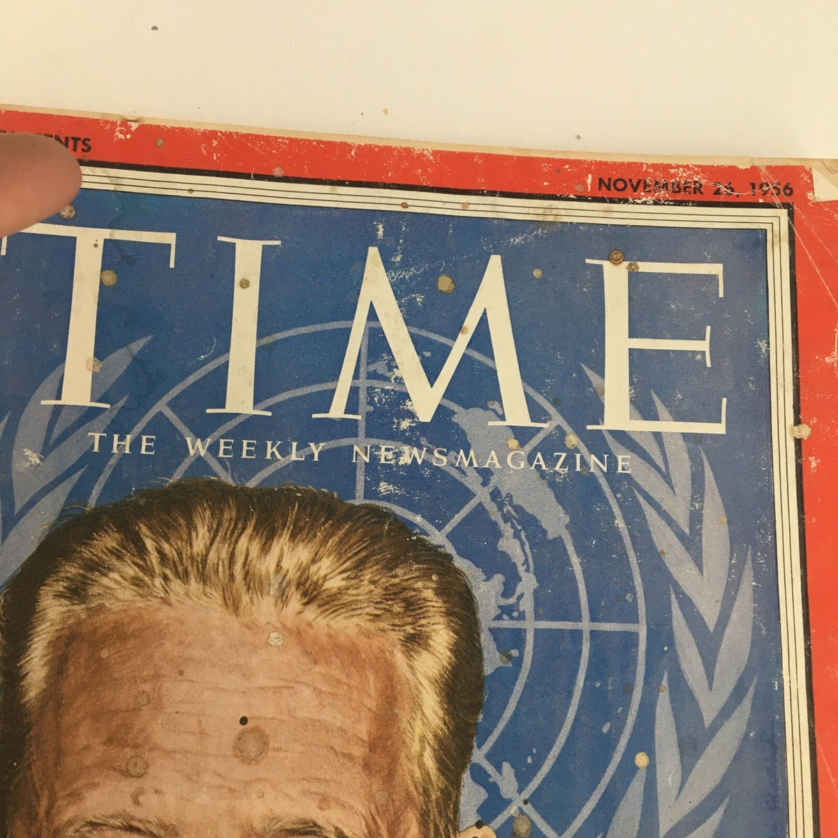 Close-up of the Time Magazine November 26 1956 cover highlighting the title and date, with visible aging marks and wear.