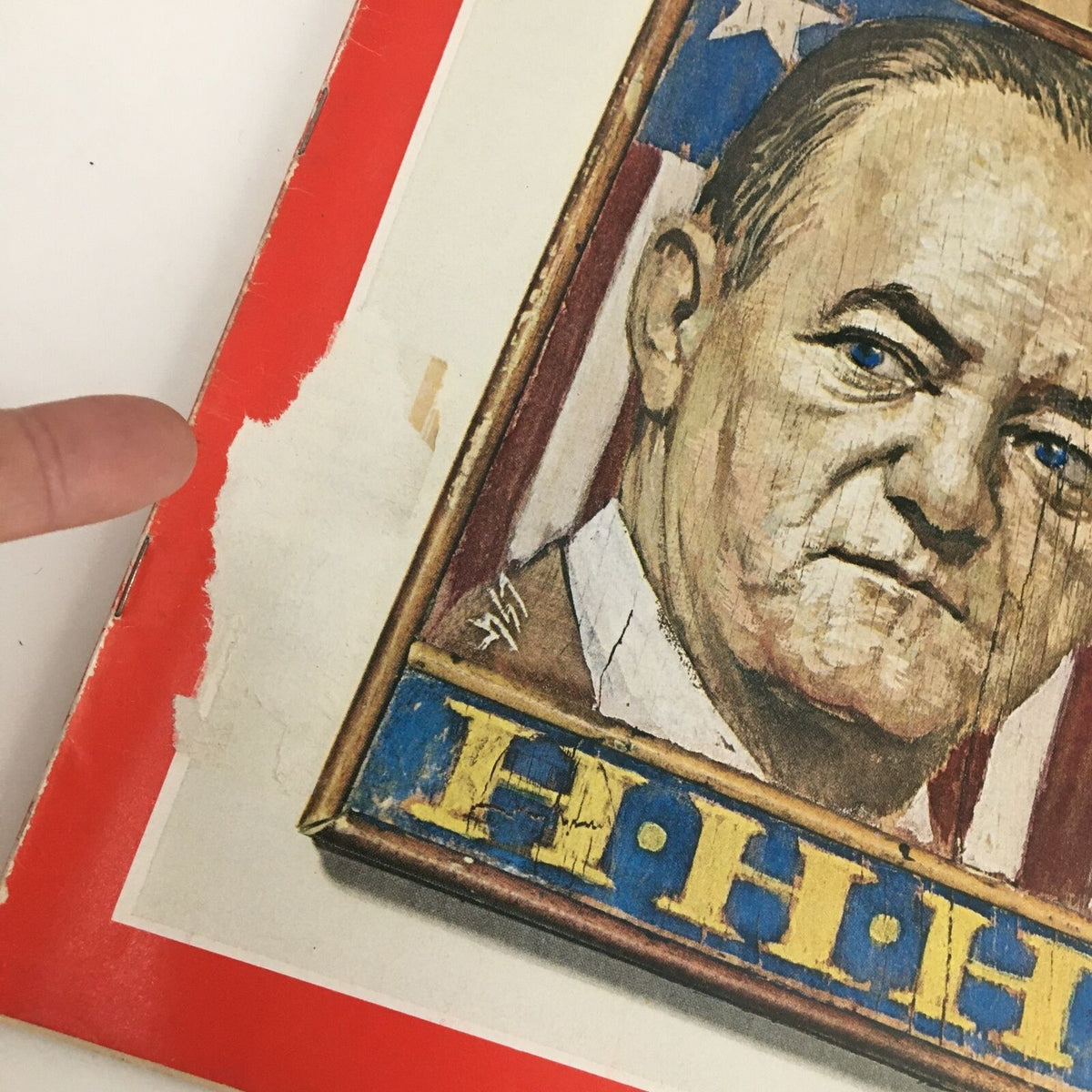 Time Magazine May 3 1968 cover featuring Vice President Hubert Horatio Humphrey, showcasing artistic elements alongside a finger pointing at a worn edge of the magazine, highlighting vintage details and condition.