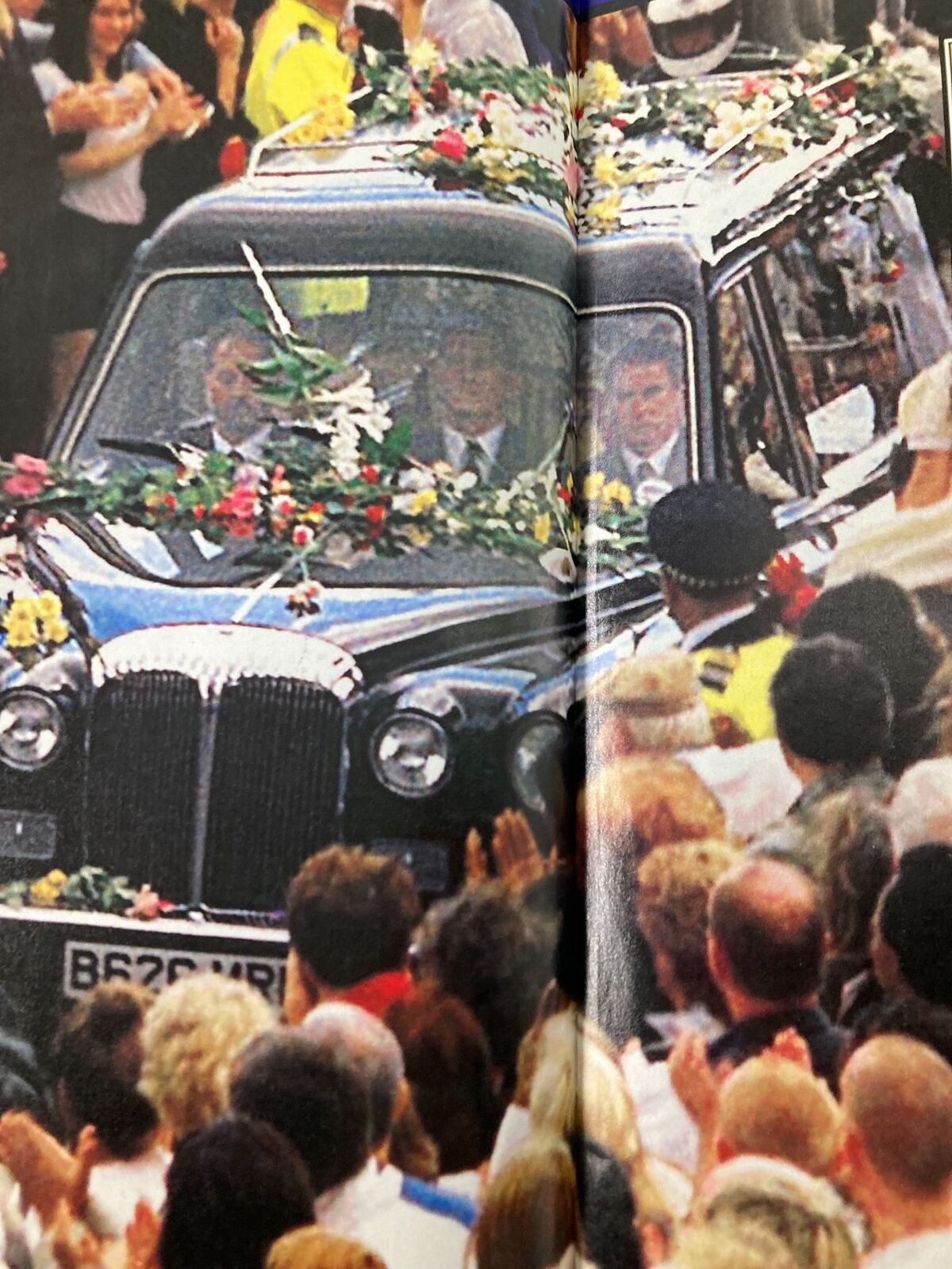 Time Magazine September 15 1997 - The funeral car carrying Princess Diana of Wales drives through the crowd, lined with flowers and mourners.