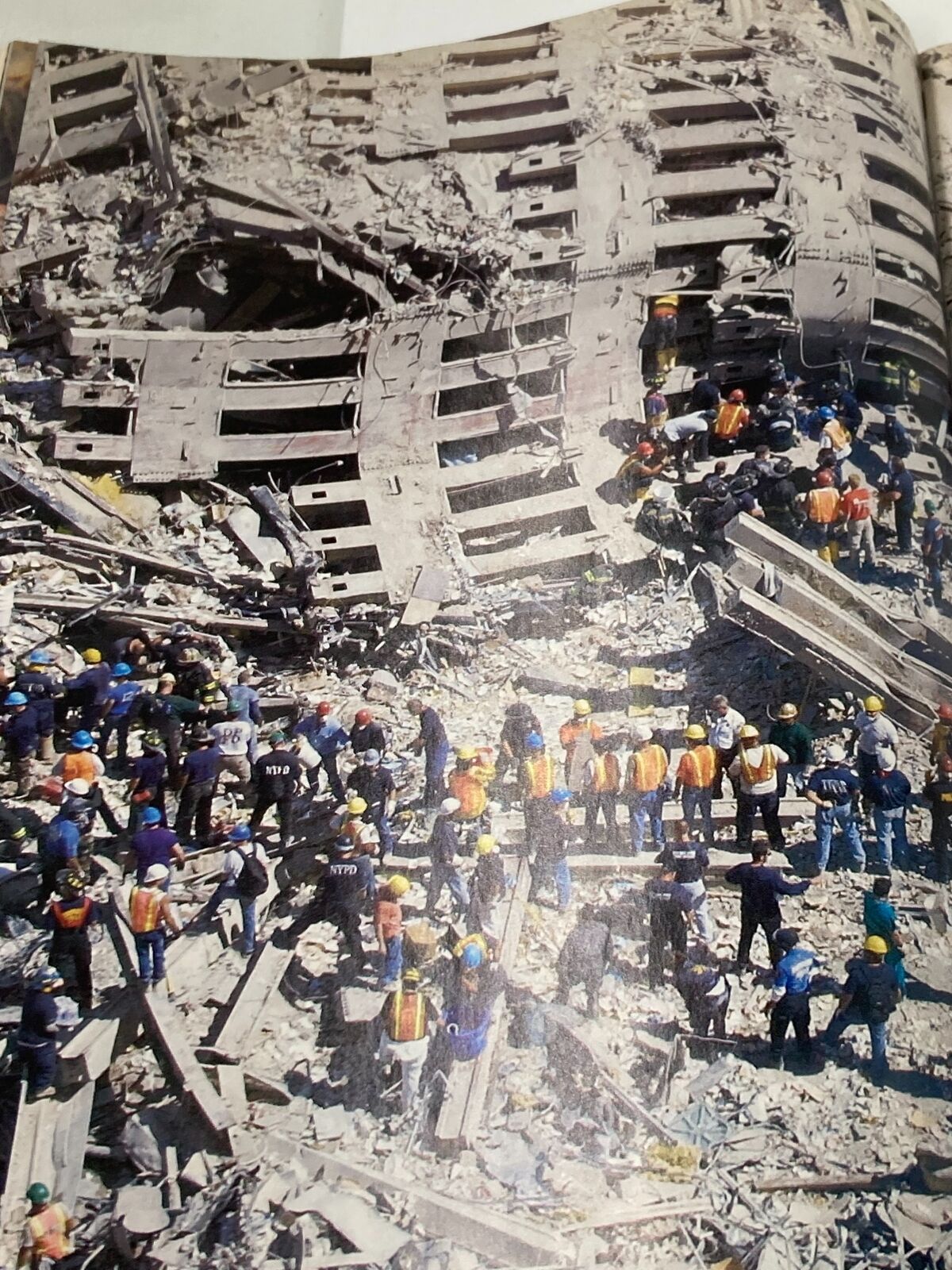 Time Magazine September 24 2001 image showing emergency responders navigating the ruins of the World Trade Center after the September 11 attacks.