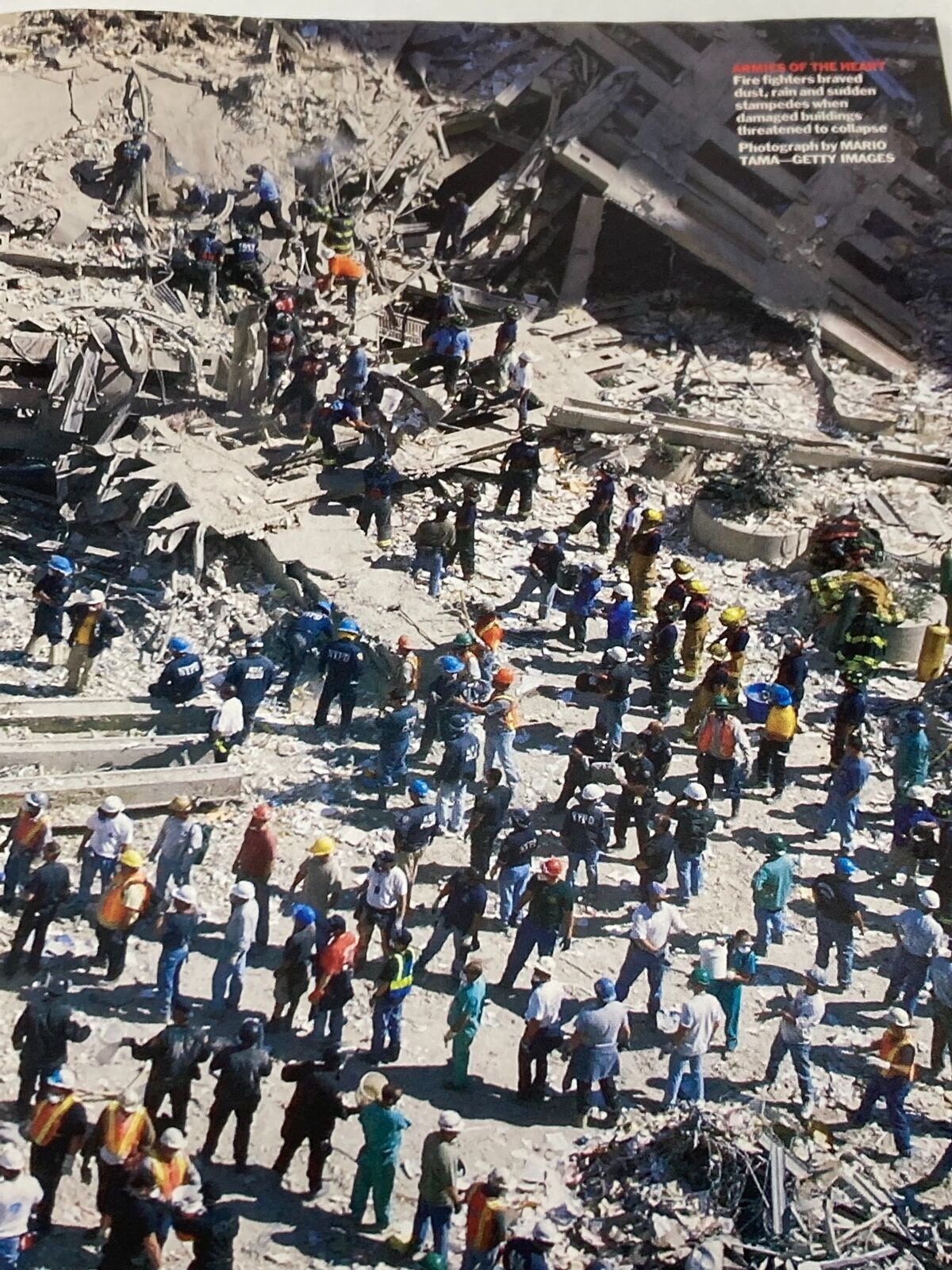 Time Magazine September 24 2001 photograph capturing the scene of rescue operation workers amidst the debris of the World Trade Center post 9/11.