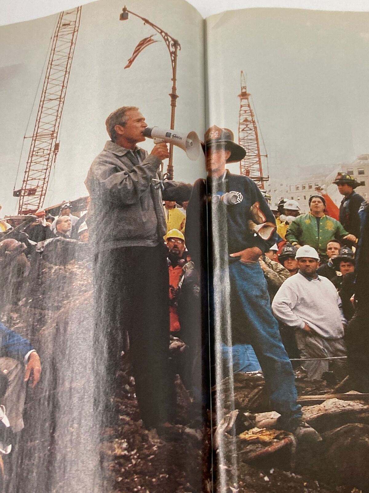Time Magazine September 24 2001 image depicting George W. Bush speaking with a megaphone at Ground Zero, symbolizing leadership and unity after 9/11.