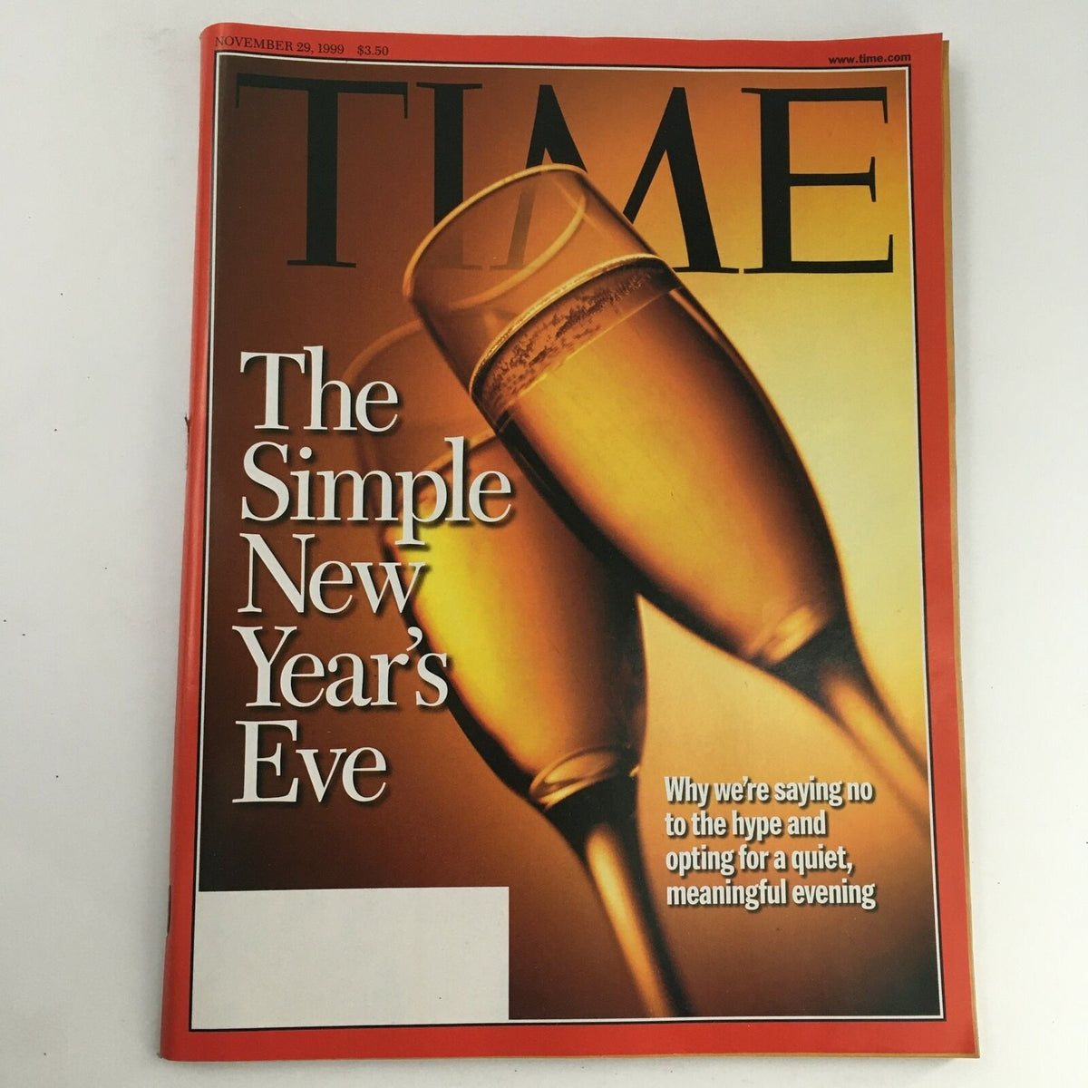 Time Magazine cover from November 29, 1999, featuring the title 'The Simple New Year's Eve: A Meaningful Evening', showcasing champagne glasses and an inviting golden background.