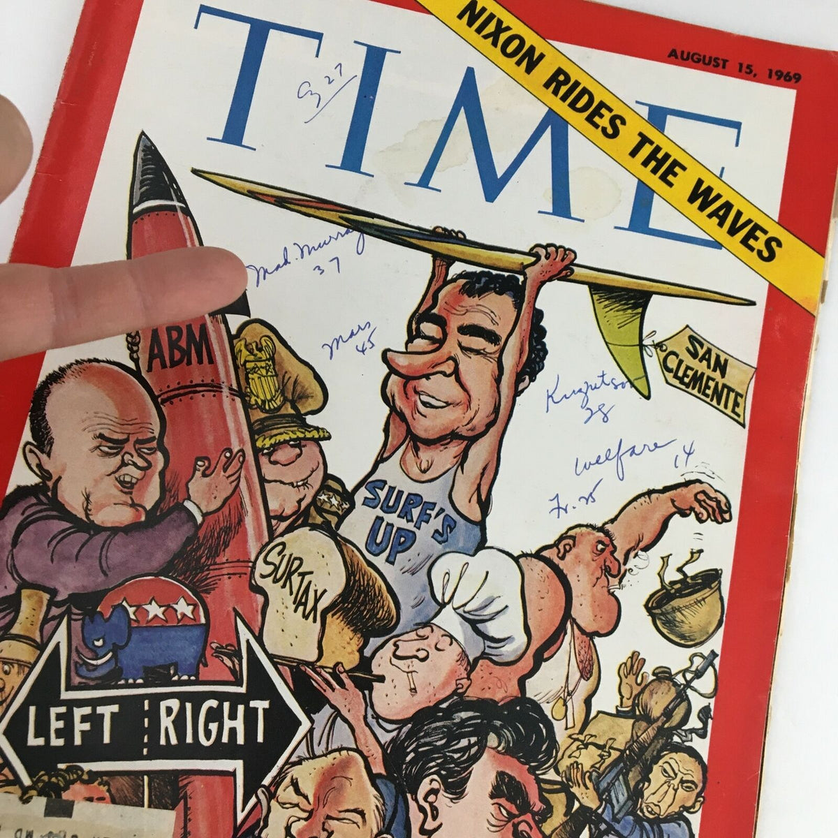 Time Magazine August 15 1969 cover, showcasing Richard Nixon cartoonishly holding a surfboard, with speech bubbles and caricatures of other political figures. The title reads 'Nixon Rides The Waves'.