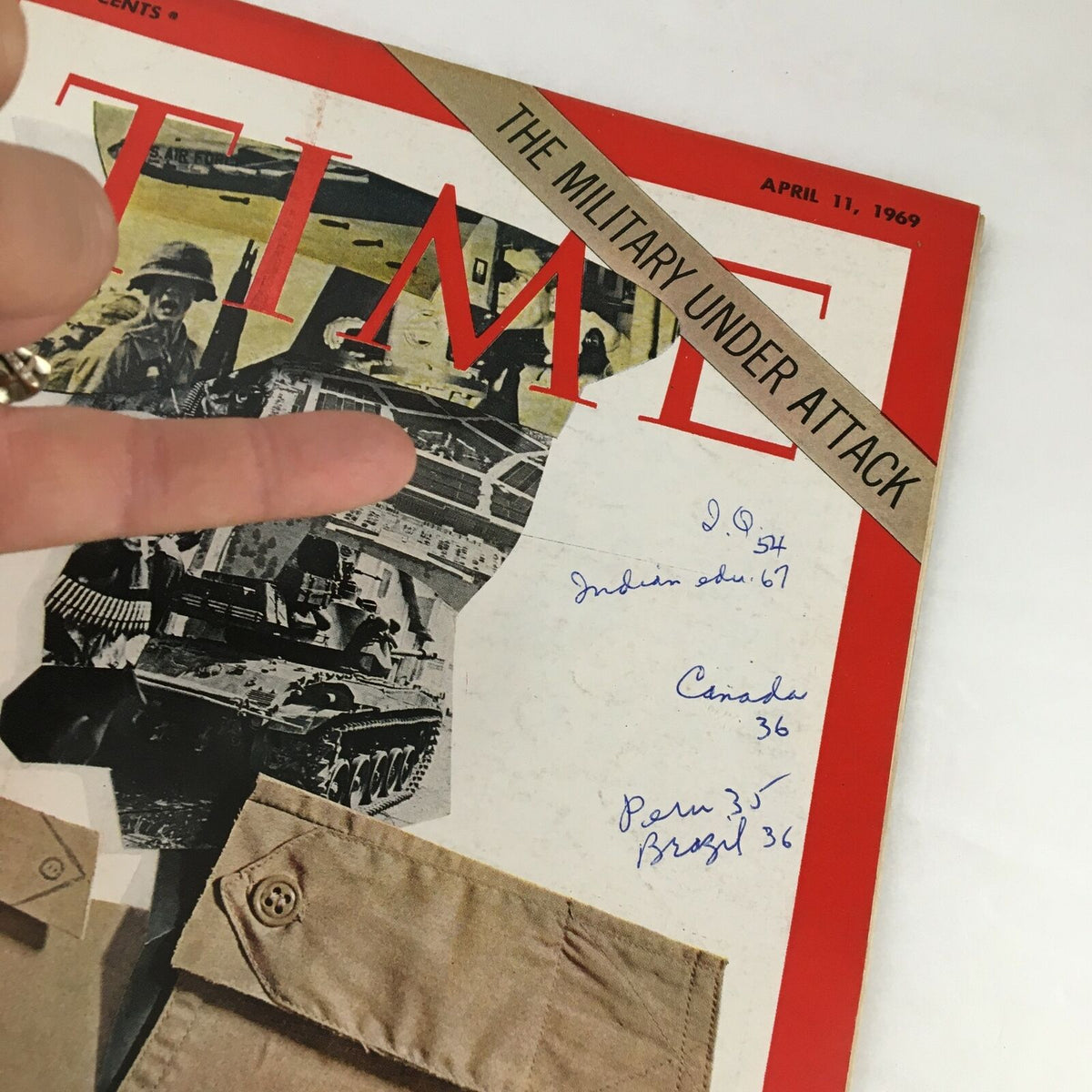 Close-up view of the Time Magazine cover from April 11, 1969, titled 'The Military Under Attack,' highlighting the military imagery along with unique handwritten notes. This issue is a valuable piece for collectors and history enthusiasts.