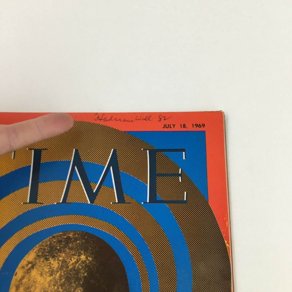 Time Magazine July 18 1969 cover showcasing a vibrant design with bold colors and lunar imagery, featuring a handwritten note at the top. This historic edition commemorates lunar exploration.