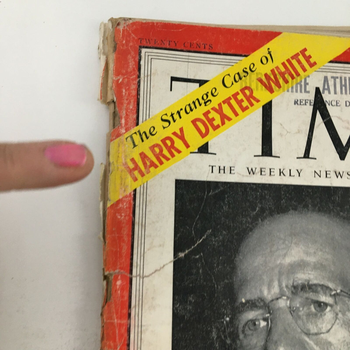 Close-up of Time Magazine November 23 1953 cover showing the title 'The Strange Case of Harry Dexter White,' with a finger pointing at it.