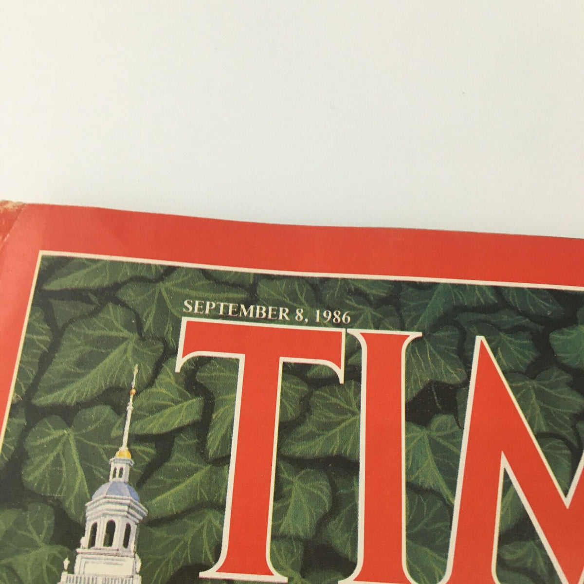 Close-up of the cover of VTG Time Magazine September 8 1986, highlighting the date and vibrant imagery related to Harvard and Derek Bok.