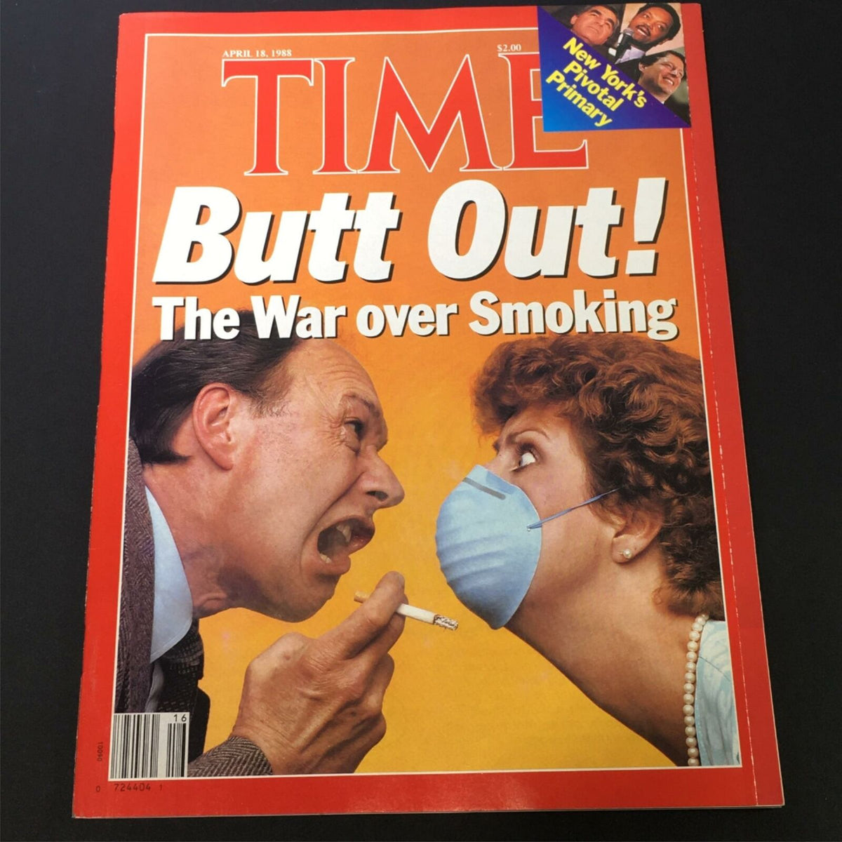 VTG Time Magazine cover from April 18, 1988, featuring the title 'Butt Out! The War over Smoking,' showcasing a dramatic illustration of two individuals in a confrontation over smoking, emphasizing the societal debates on tobacco use.