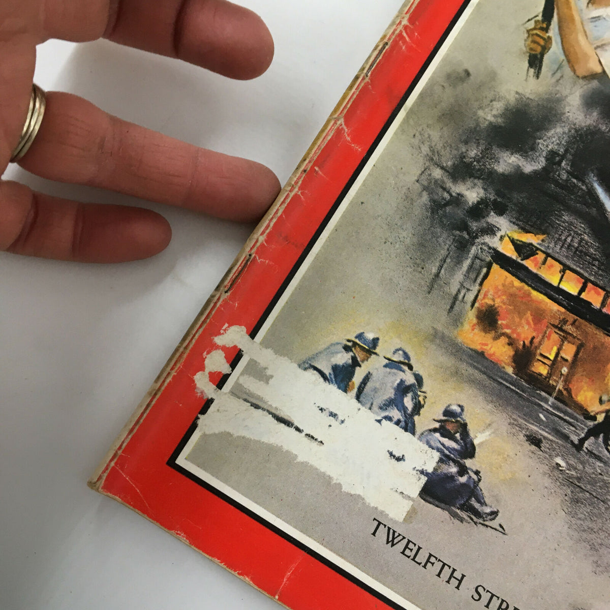 Close-up view of the cover of Time Magazine August 4, 1967, highlighting the wear and tear on the spine and edge, featuring Twelfth Street, Detroit.