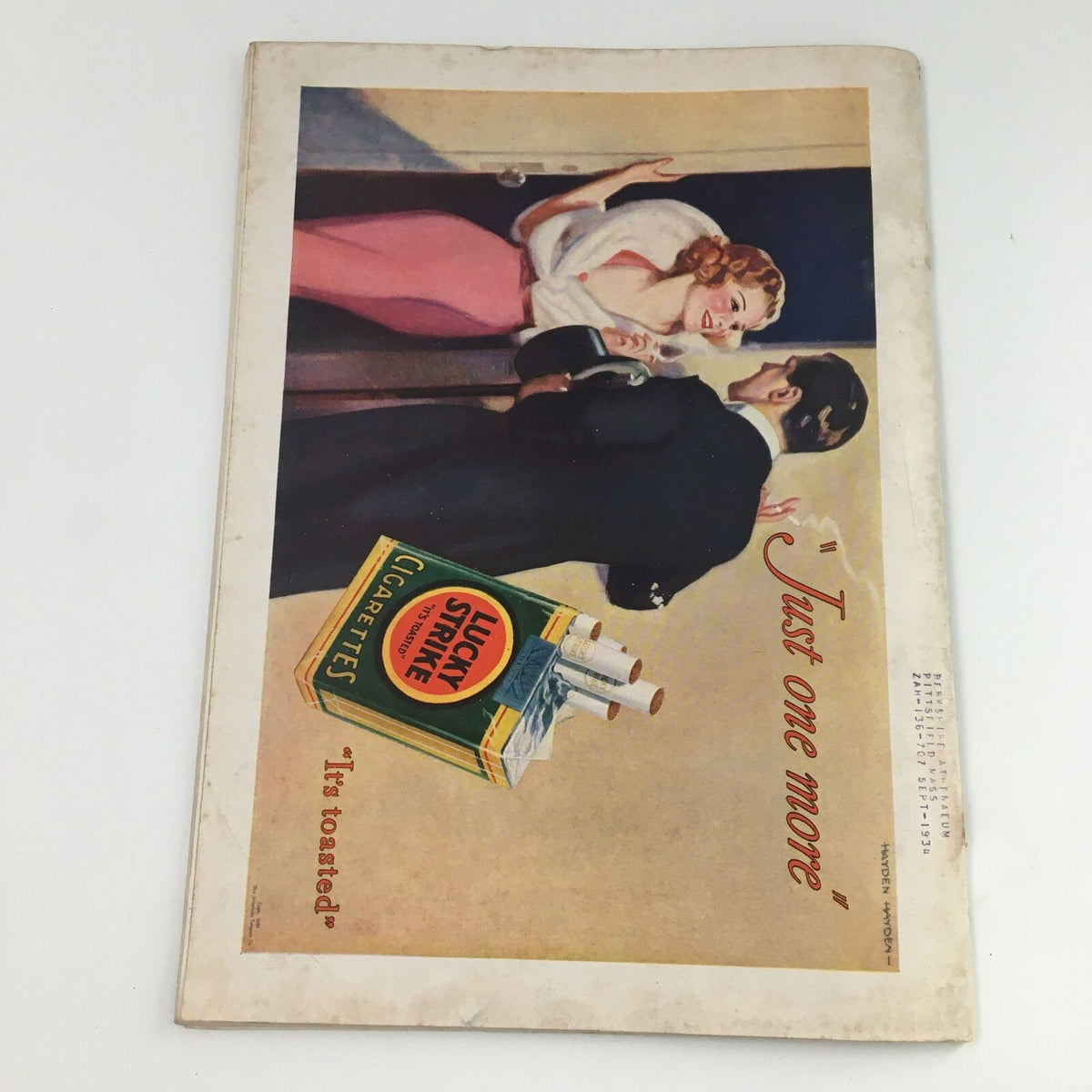 Back cover of Time Magazine from October 16, 1933, showcasing a vintage advertisement for Lucky Strike cigarettes with a playful interaction between a man and a woman.