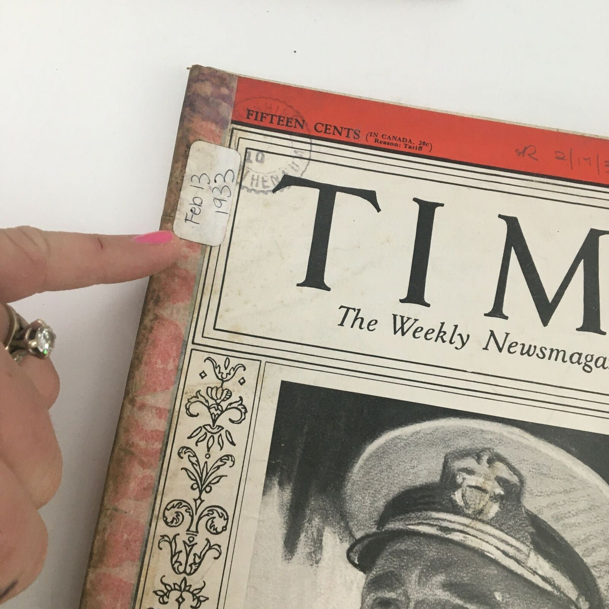 Close-up of the top left corner of Time Magazine dated February 13, 1933, showing the date sticker and additional details from the cover. Highlights the historical aspects of the magazine featuring Admiral Richard Henry Leigh.