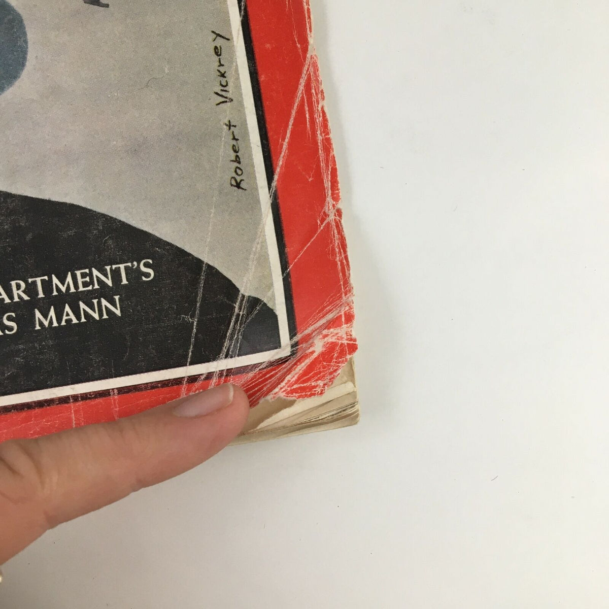 Close-up of the edge of Time Magazine January 31, 1964, highlighting wear and tear indicative of its vintage condition.