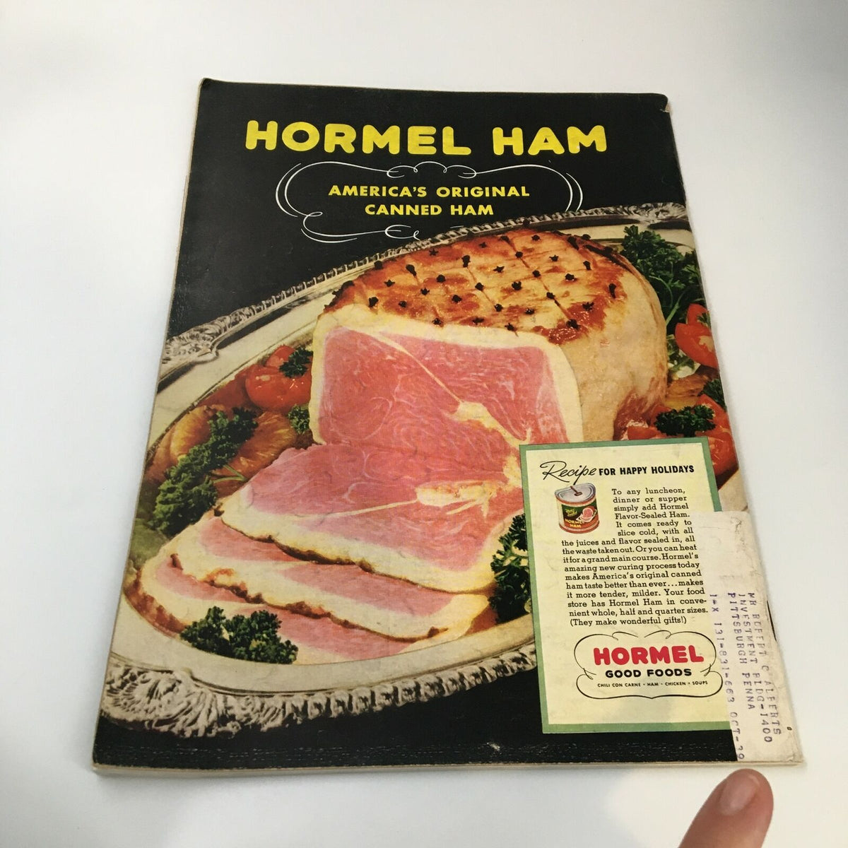 Cover of Hormel Ham recipe booklet, featuring a beautifully plated canned ham, representing vintage food advertising.