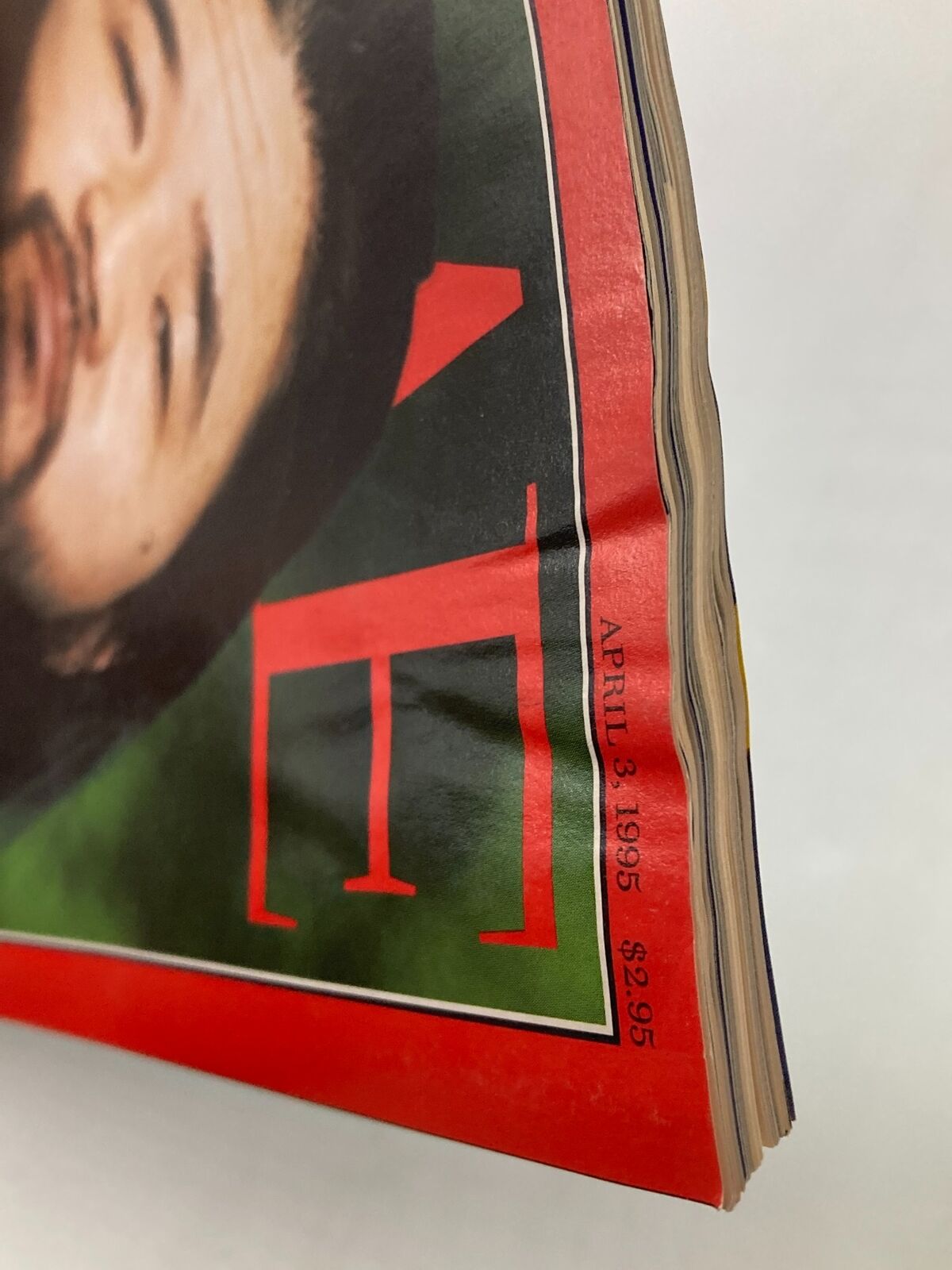 Close-up view of the vintage Time Magazine from April 3, 1995, featuring Shoko Asahara, with a visible date and price, showcasing the magazine's edge and cover details related to the controversial leader of the Aum Shinrikyo cult.