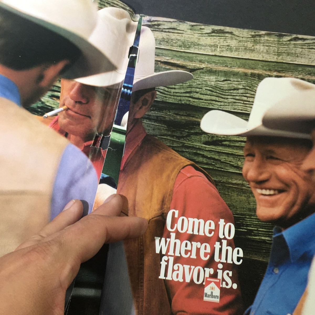 Cycle World Magazine May 1999 interior page showcasing a vintage advertisement with cowboys and Marlboro branding.
