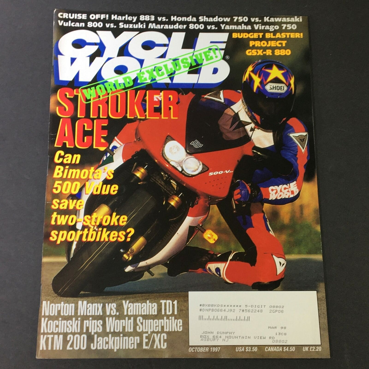 Cover of Cycle World Magazine - October 1997 featuring a thrilling motorcycle showdown between Harley 883, Honda Shadow 750, and Kawasaki Vulcan 800, showcasing a rider in action on a sporty motorcycle, alongside promotional text highlighting exclusive articles.