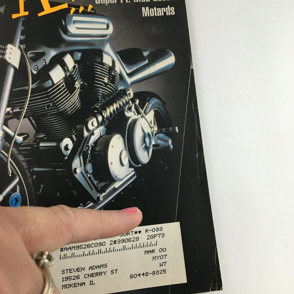 Close-up of Cycle World Magazine January 2000 featuring Yamaha MT-01 1600CC V-Twin, showing details of the magazine cover and an address label.