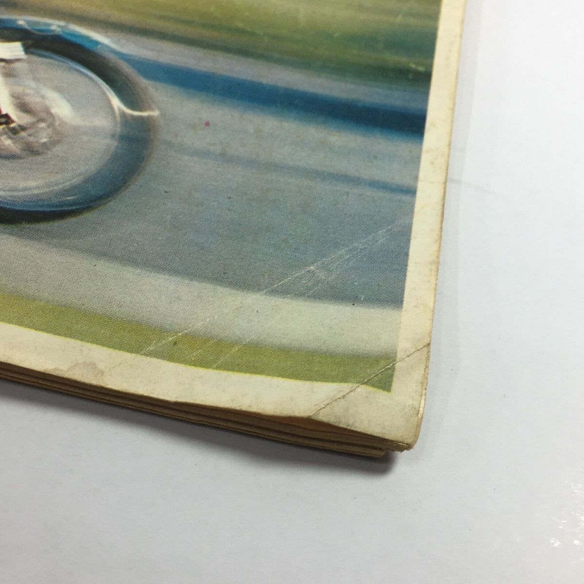 Close-up of the edge of the VTG Cycle Magazine July 1969, showing wear and minor rips.