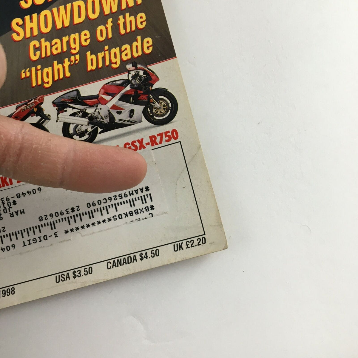 Close-up of the Cycle World Magazine April 1998 showing the address label section and details about the issue featuring EMB Electric Bike.