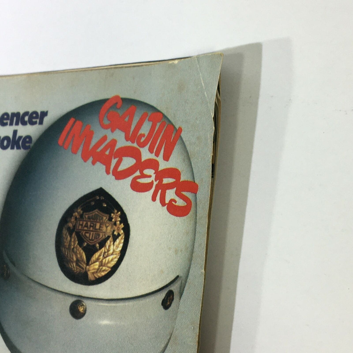Detail of VTG Cycle World Magazine December 1983, displaying the text 'Gaijin Invaders' along with a vintage motorcycle helmet.