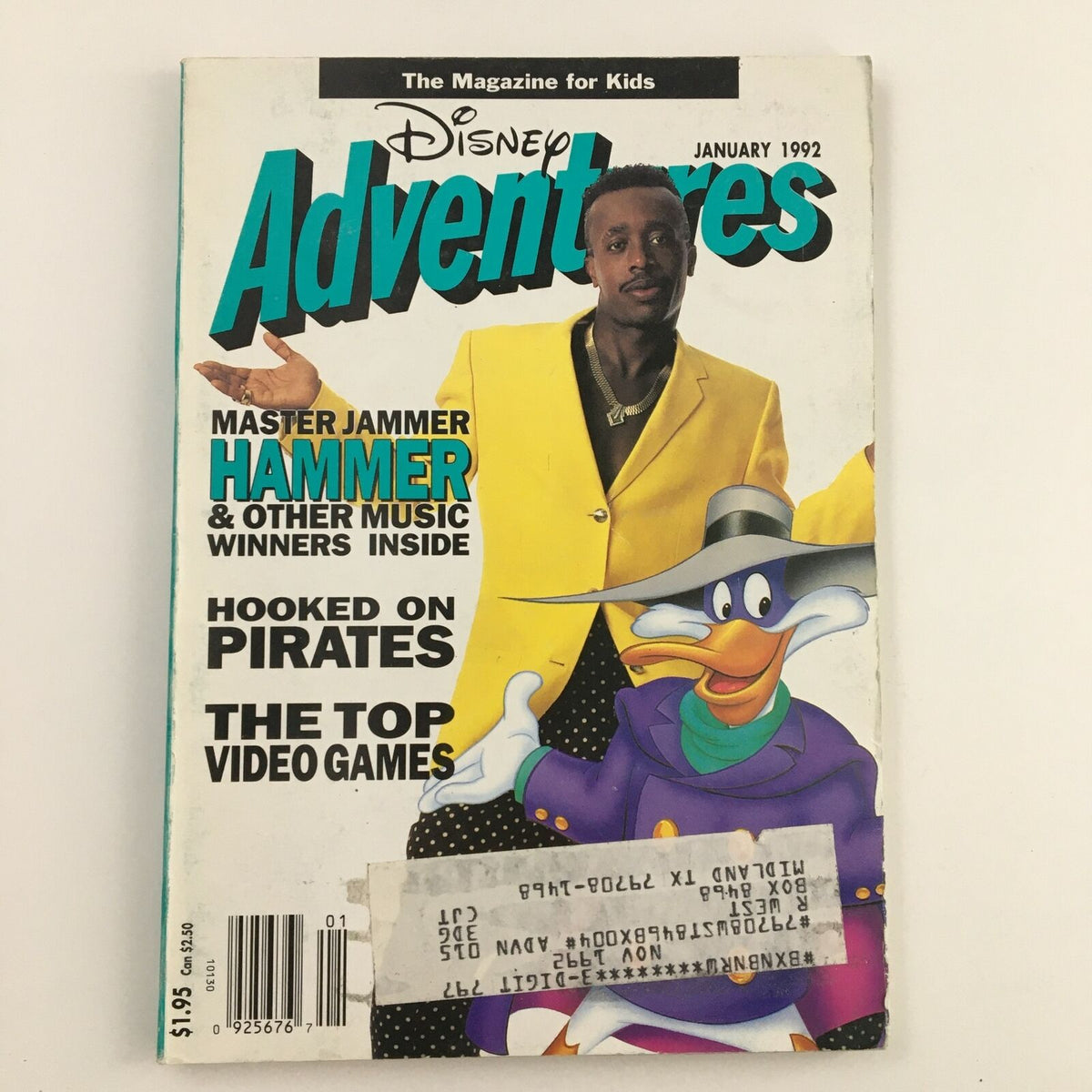Disney Adventures Magazine cover from January 1992 featuring Master Jammer Hammer in a bright yellow suit and a cartoon character, Donald Duck, promoting video games and musical content inside. Vintage collectible magazine for kids, showcasing 90s pop culture.
