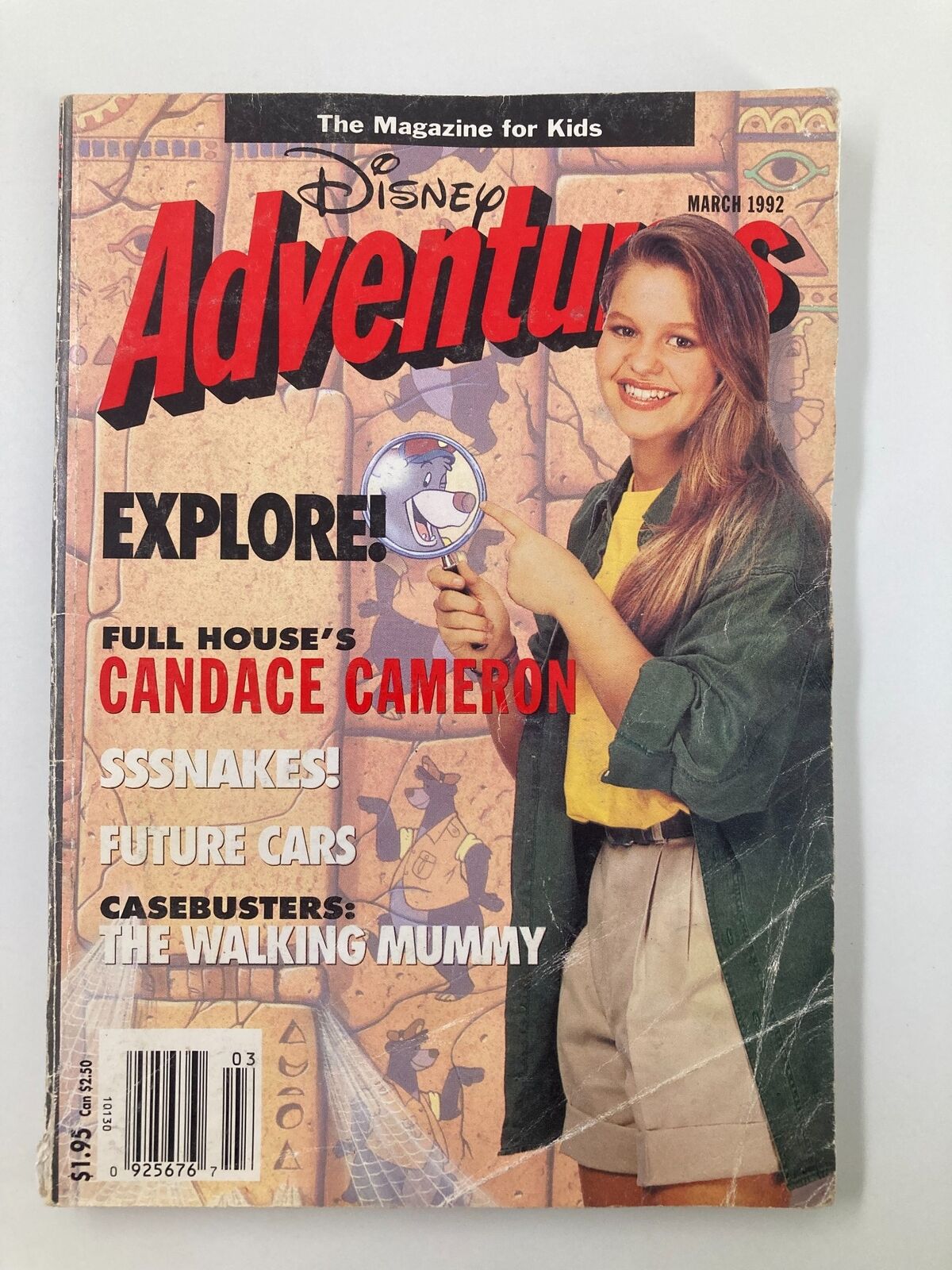 Cover of Disney Adventures Magazine March 1992 featuring Full House's Candace Cameron exploring with a magnifying glass, set against an Egyptian-themed background.