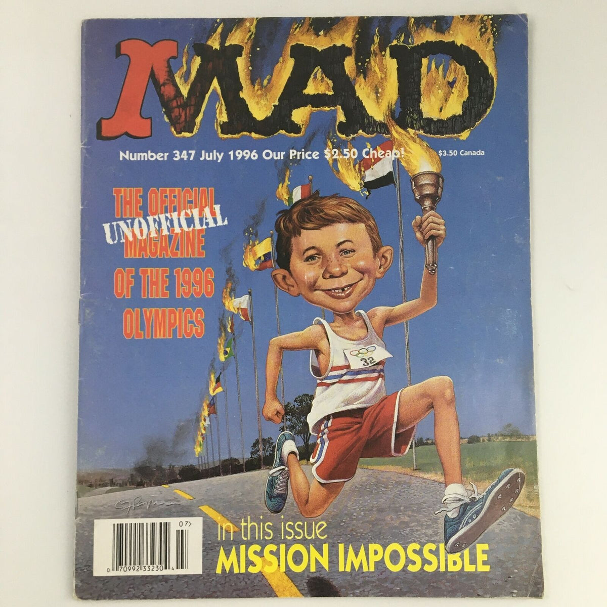 Mad Magazine July 1996 #347 featuring a parody illustration related to the 1996 Olympics, showcasing a smiling cartoon character running with a torch in front of Olympic flags.