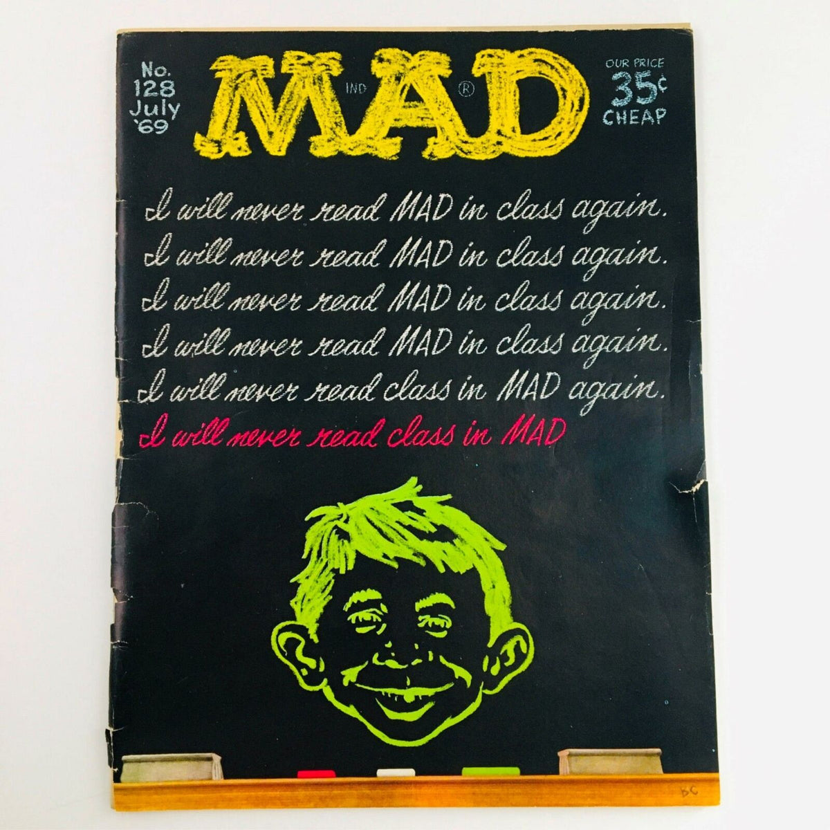 Cover of Mad Magazine July 1969 No. 128 featuring the title 'I Will Never Read MAD In Class Again' with a vibrant illustration of a grinning character on a black background.
