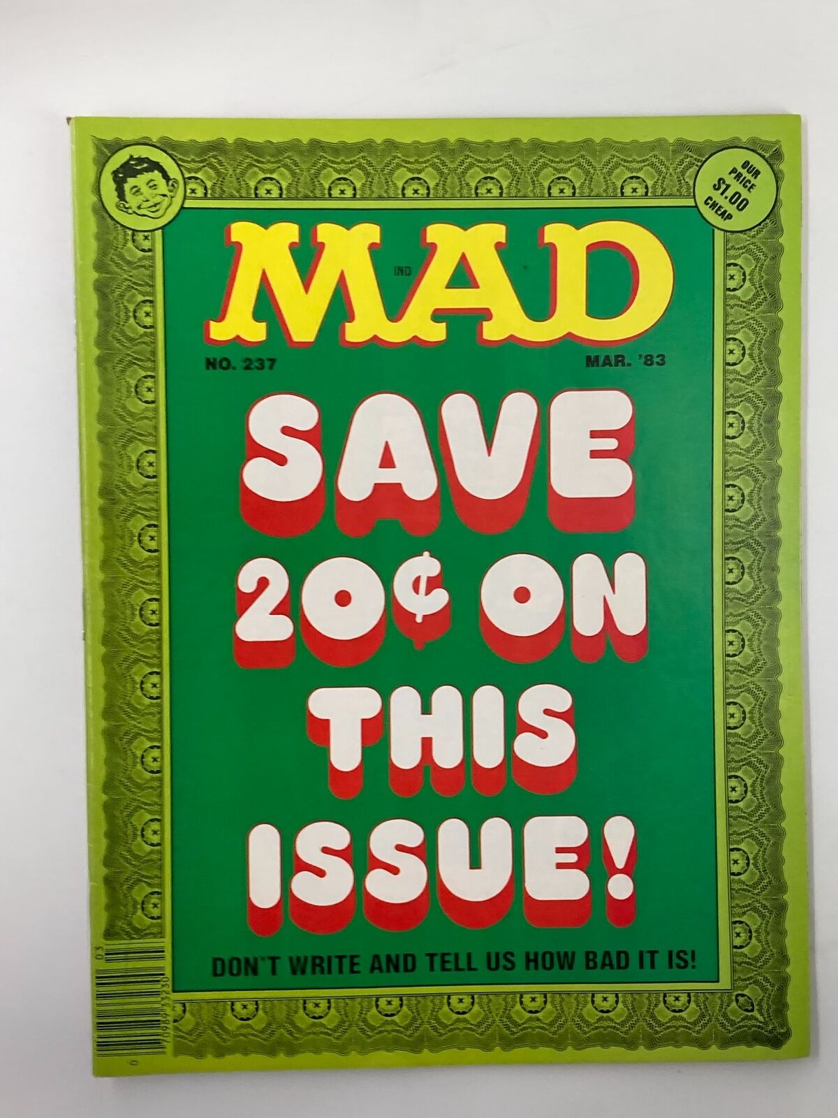 Cover of Mad Magazine March 1983 No. 237 featuring vibrant green colors and bold text that reads 'SAVE 20¢ ON THIS ISSUE! DON'T WRITE AND TELL US HOW BAD IT IS!'. An iconic piece for collectors and fans of vintage magazines.