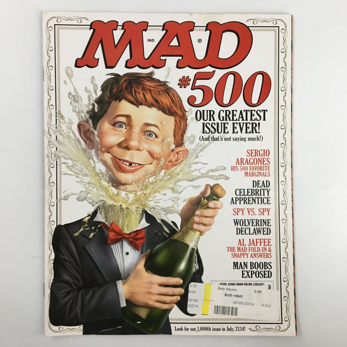 Cover of Mad Magazine June 2009 No. 500 featuring a caricature of a young boy popping champagne with a splash, titled 'Our Greatest Issue Ever!' and showcasing various humor themes including 'Dead Celebrity Apprentice' and 'Spy vs. Spy'.