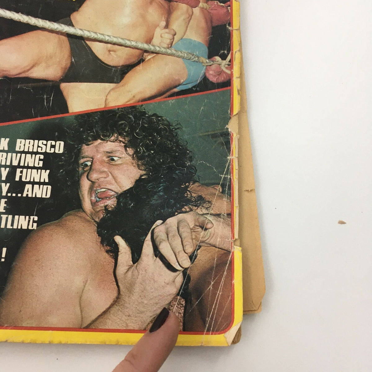 Inside Wrestling Magazine March 1977 displaying an intense wrestling scene with Jack Brisco in action, illustrating the dramatic moments of professional wrestling.