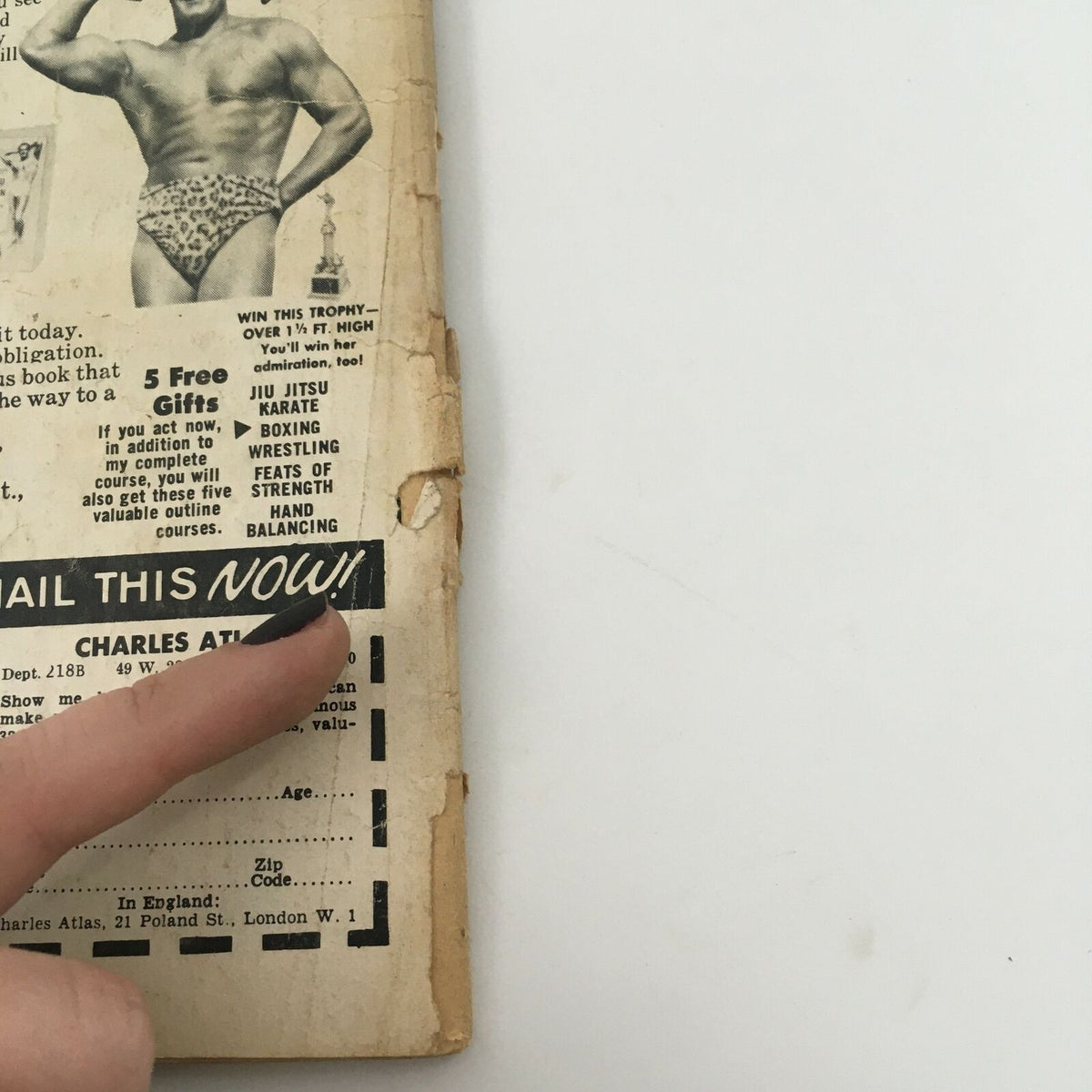 Back cover of Inside Wrestling Magazine March 1977 featuring an advertisement for wrestling courses and a prominent finger pointing to a call to action to 'MAIL THIS NOW!'.