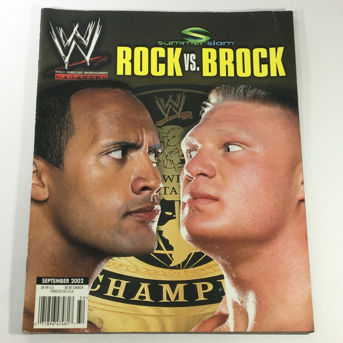 World Wrestling Magazine September 2002 featuring Dwayne Johnson and Brock Lesnar in a dramatic face-off, showcasing the iconic rivalry between The Rock and Brock Lesnar during WWE's peak years.