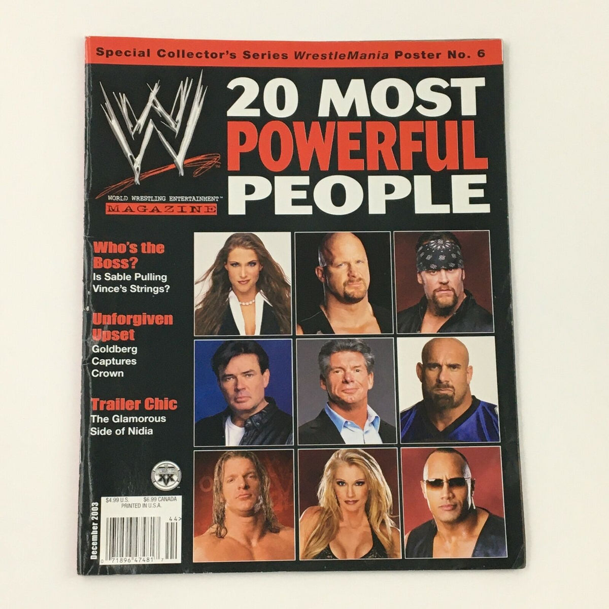 WWE Magazine December 2003 featuring The Rock, Vince McMahon, and Linda McMahon on the cover, highlighting wrestling icons with a vintage aesthetic.