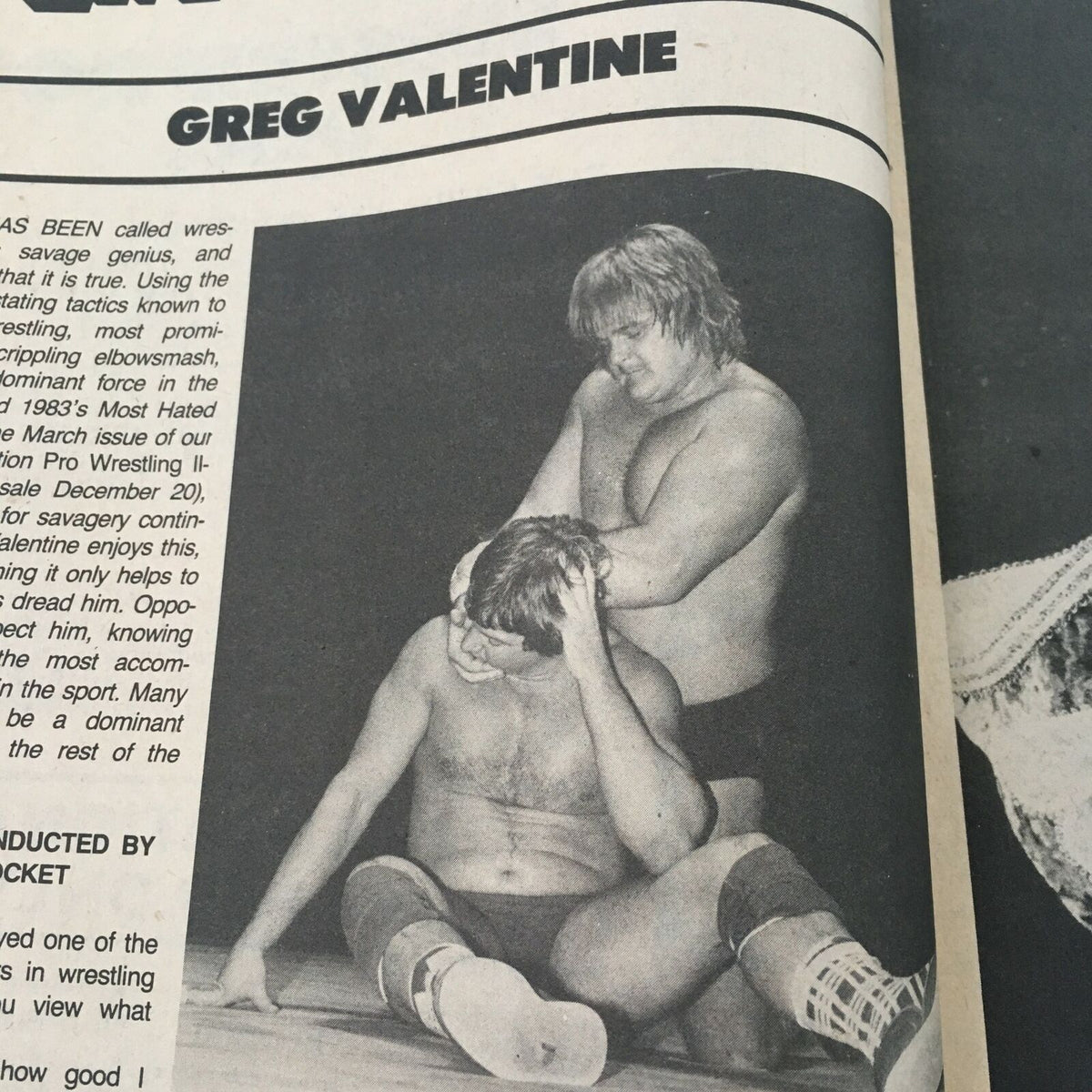 Image featuring Greg Valentine in a wrestling match, as seen in the Wrestling Superstars Magazine Spring 1984, showcasing his wrestling technique on an opponent.