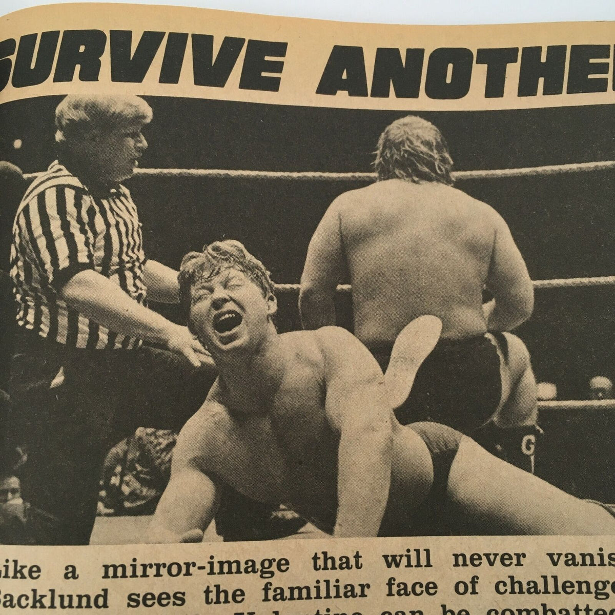 Wrestling match scene showing a wrestler in pain, with a referee observing - a moment from Sports Review Wrestling Magazine Winter 1981: Ken Patera and Kerry Von Erich.
