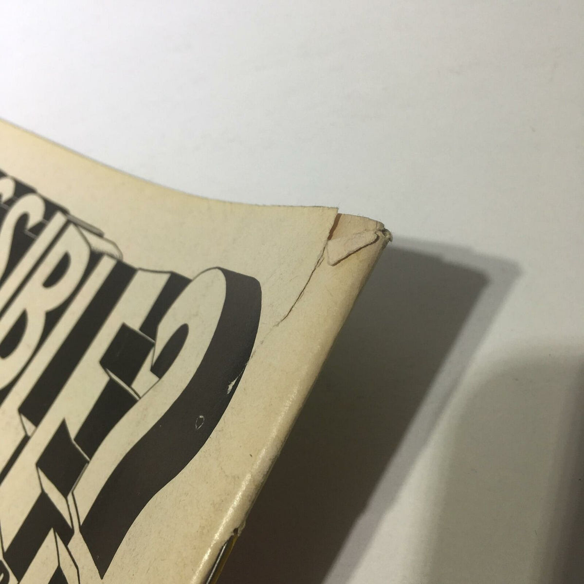 Close-up of the back cover of The Big Book of Wrestling January 1977 showing the top right corner with slight damage and bold typography.