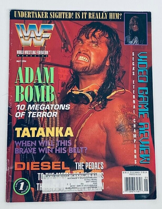 WWF World Wrestling Federation Magazine May 1994 featuring wrestlers Adam Bomb and Tatanka on the cover. The magazine includes headlines about wrestling terror and championship aspirations, showcasing vibrant graphics and bold text.