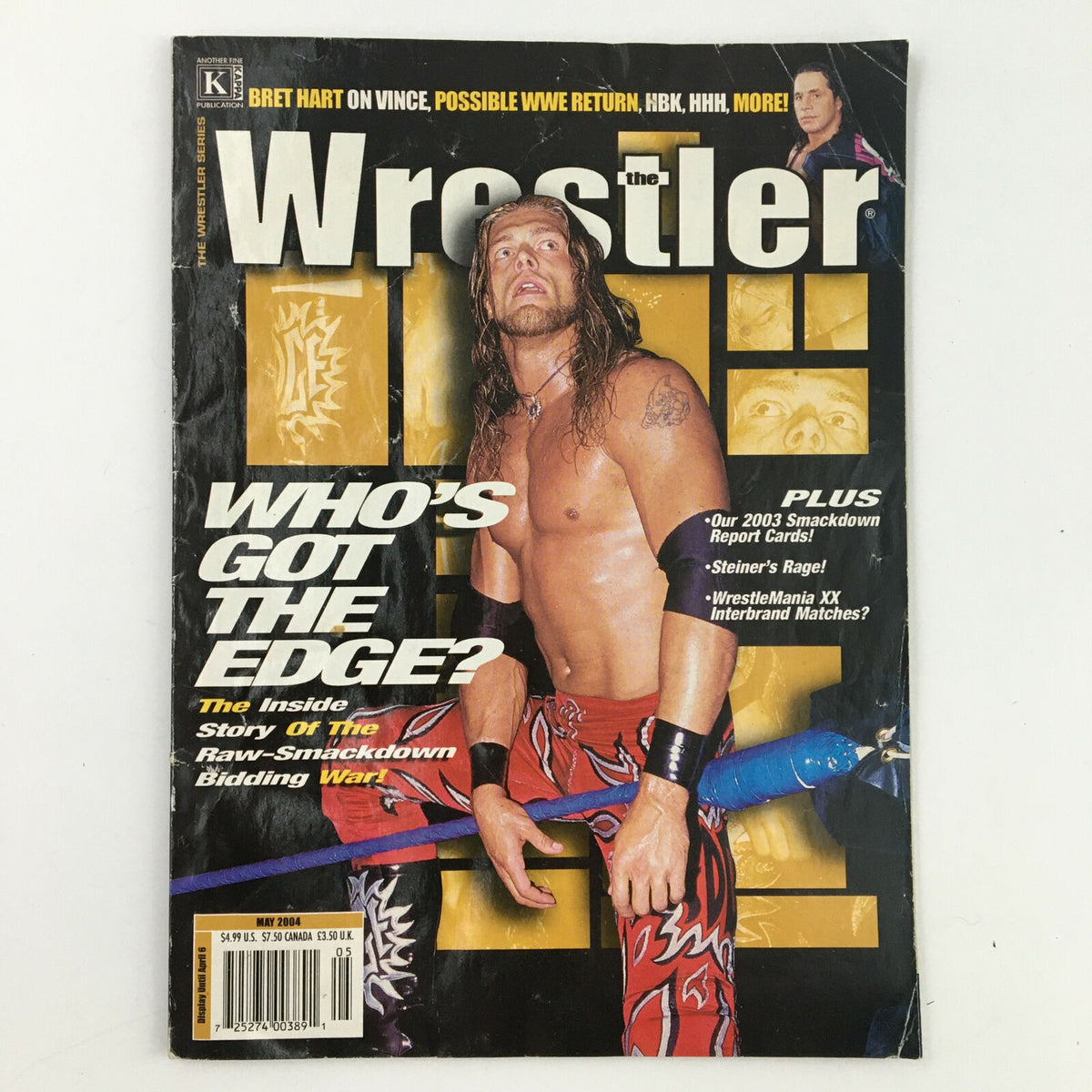 Cover of The Wrestler Magazine May 2004 featuring The Edge, showcasing the title 'Who's Got The Edge?' and highlights of the issue including articles on Bret Hart and WrestleMania.